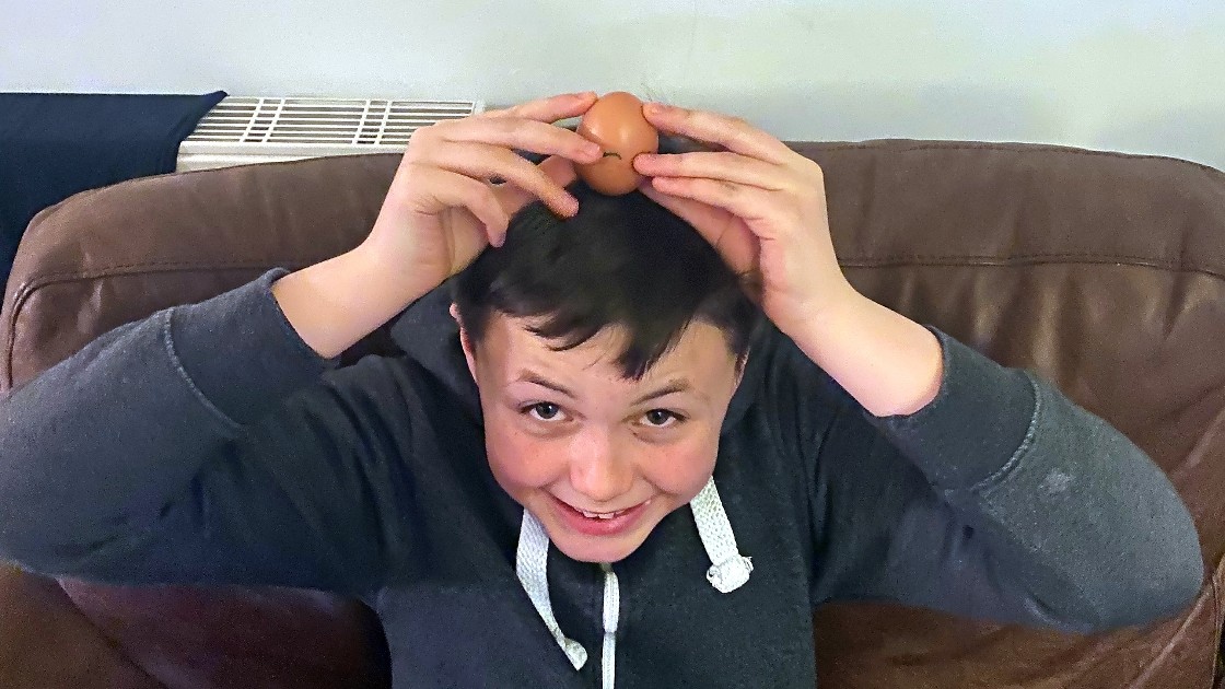 Family member holding egg