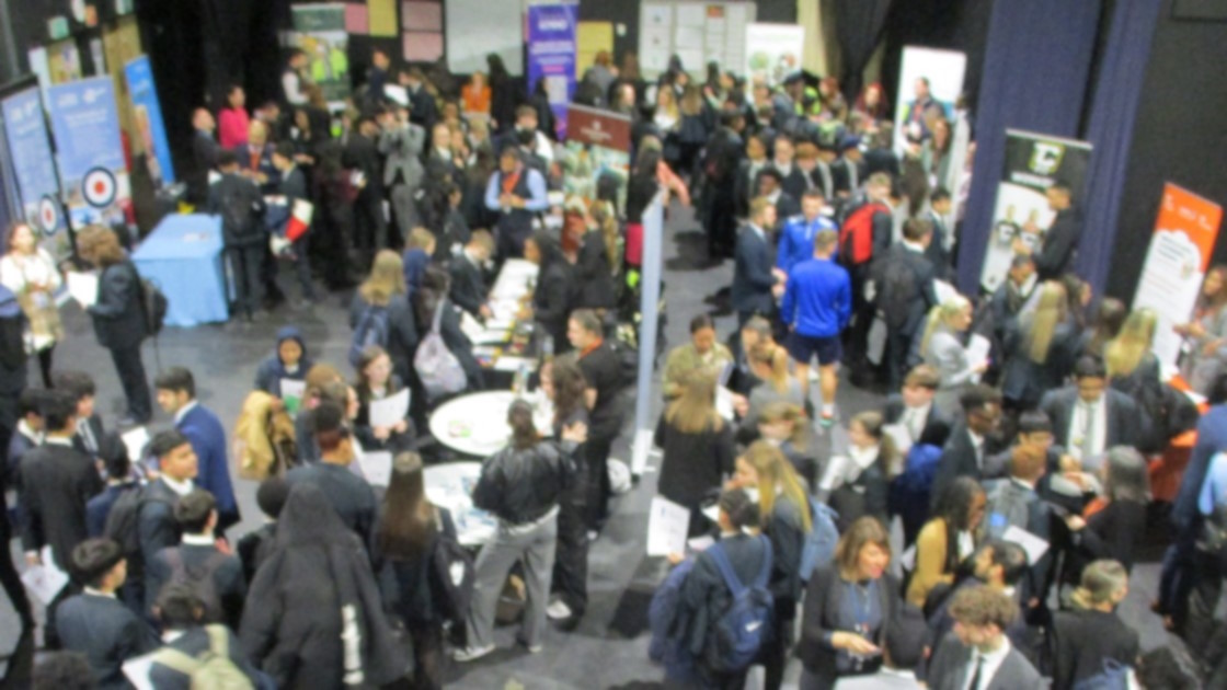 Bustling event, students networking with future employers