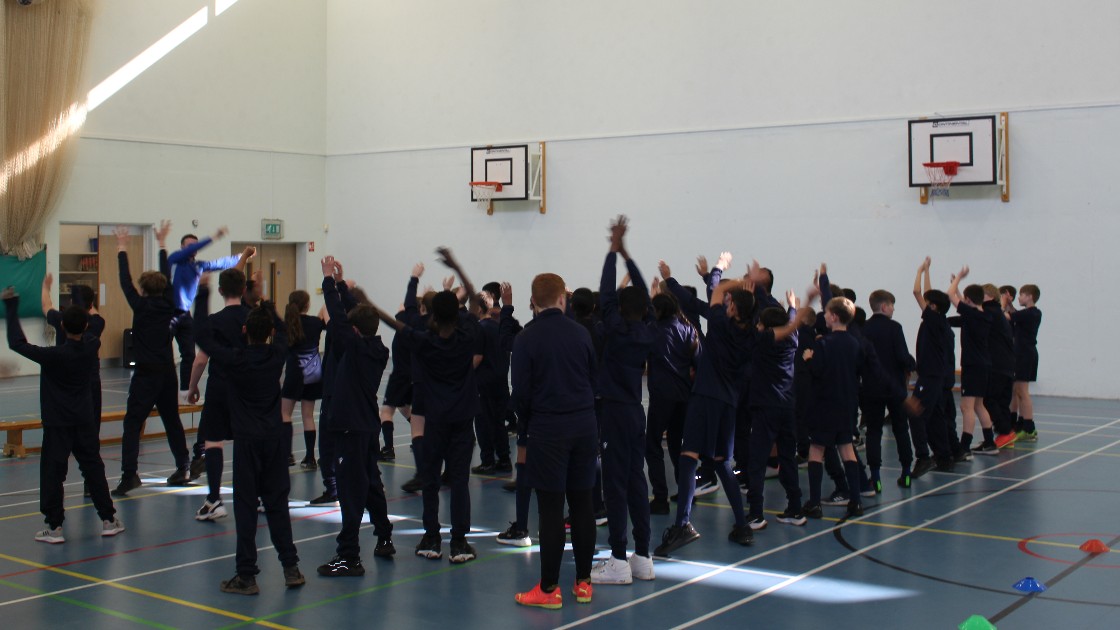 Mr Richardson warms up the Year 7 dodgeballers