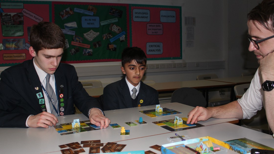 Thoughtful board gamers plot out their strategies