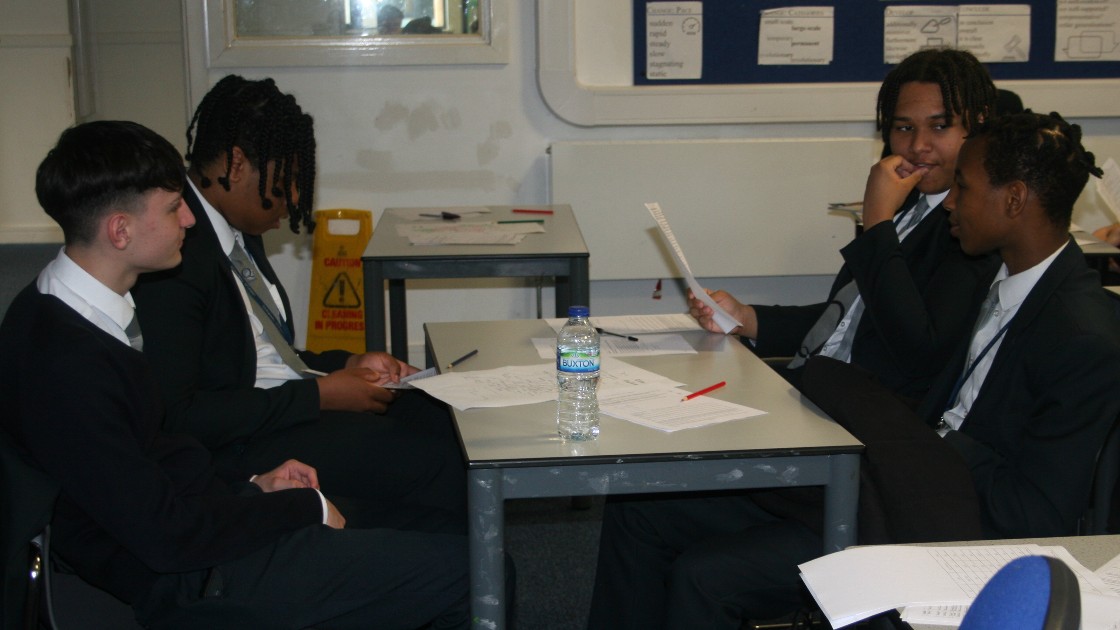 Four Year 11 students quiz their historical knowledge