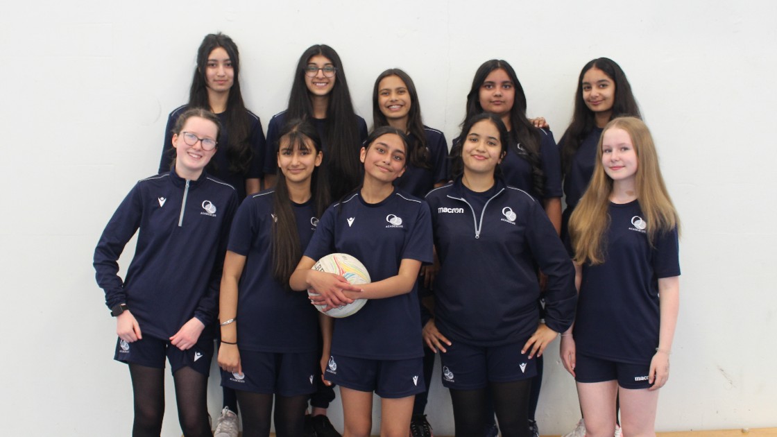 Students in a team photo with our captains Ella, Neha, Arya