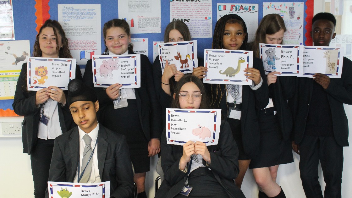 Students proudly presenting their work