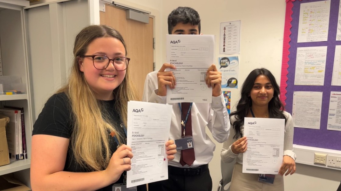 Students holding their mock papers