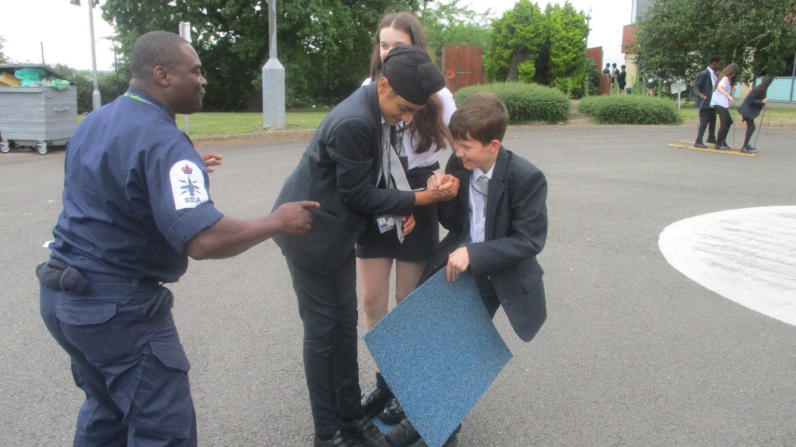 Royal Navy instructor leading an activity