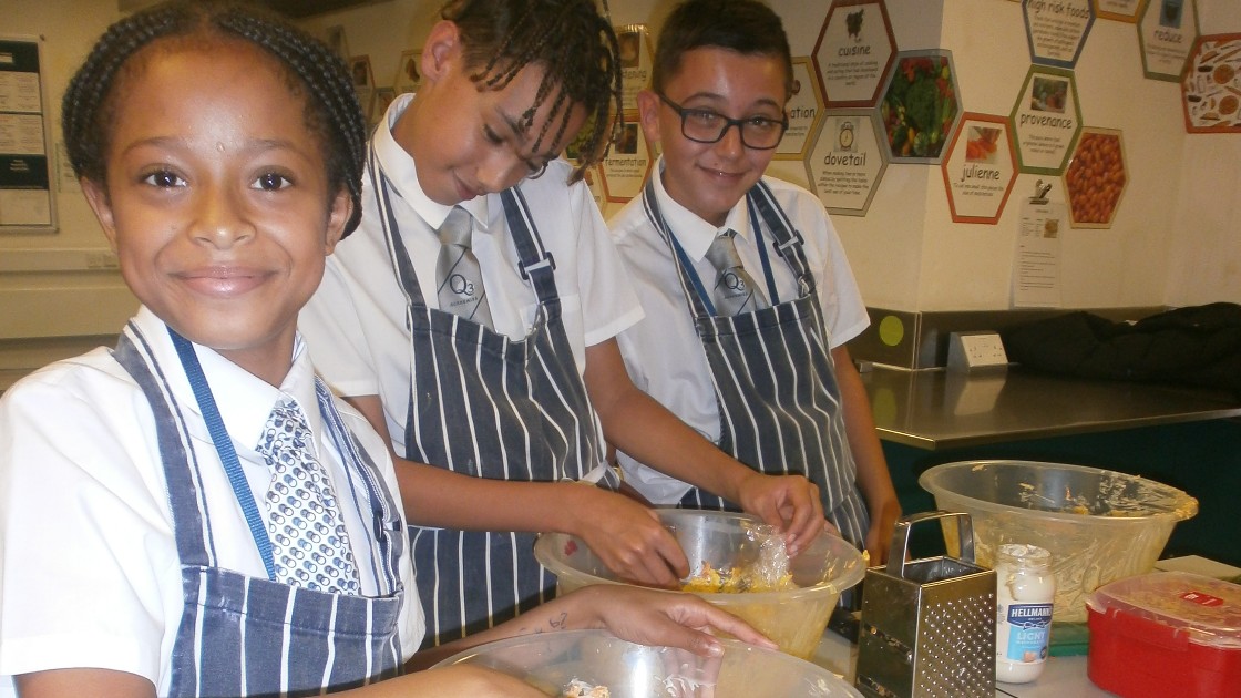 Students working together to create their dishes.