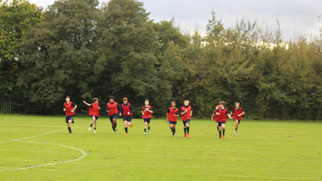 Year 8 boys warming up for the game.