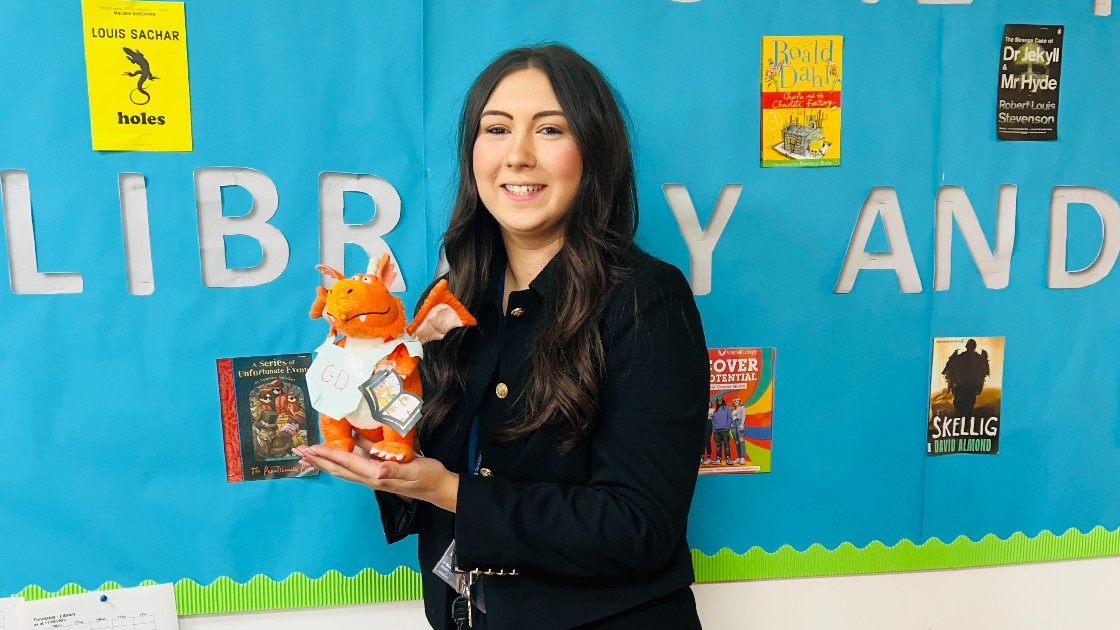 Miss Bull and Zog enjoy the library together