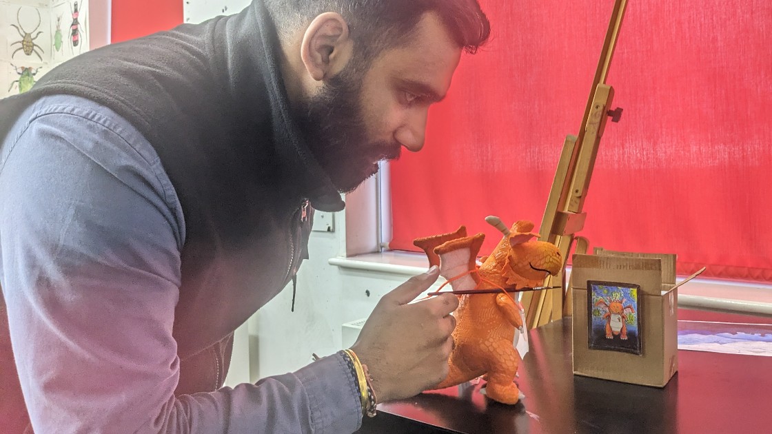 Mr Kumar helps Zog with his brushwork