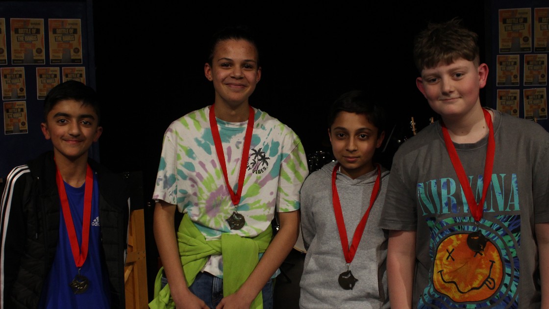 The audience award winners pose with their medals.