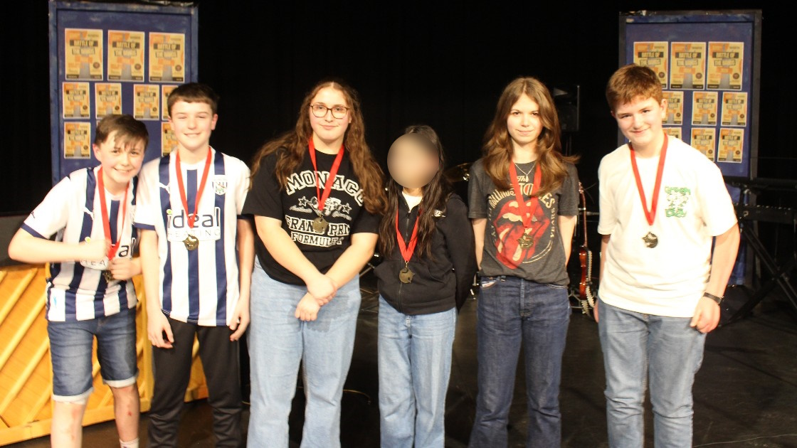 The judges' award winners pose with their medals.