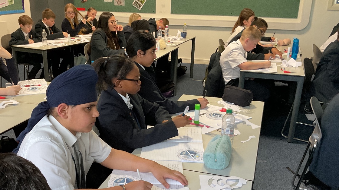 A class of students writing