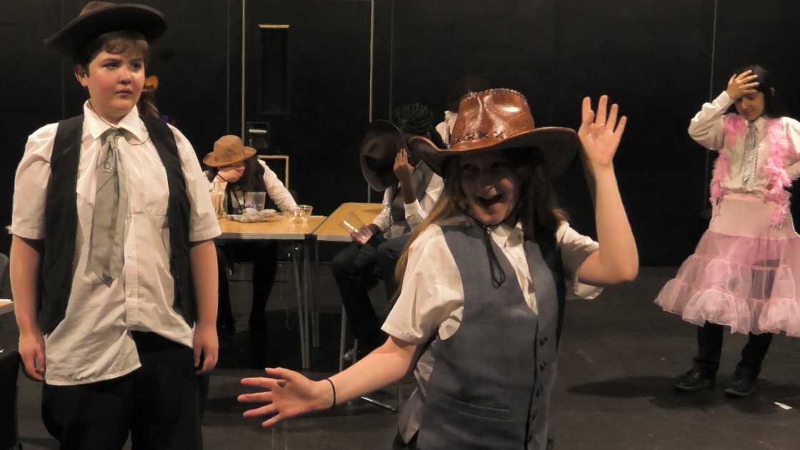 Students acting out a scene from the Western.