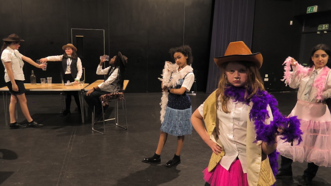 Students acting out a scene from the Western.