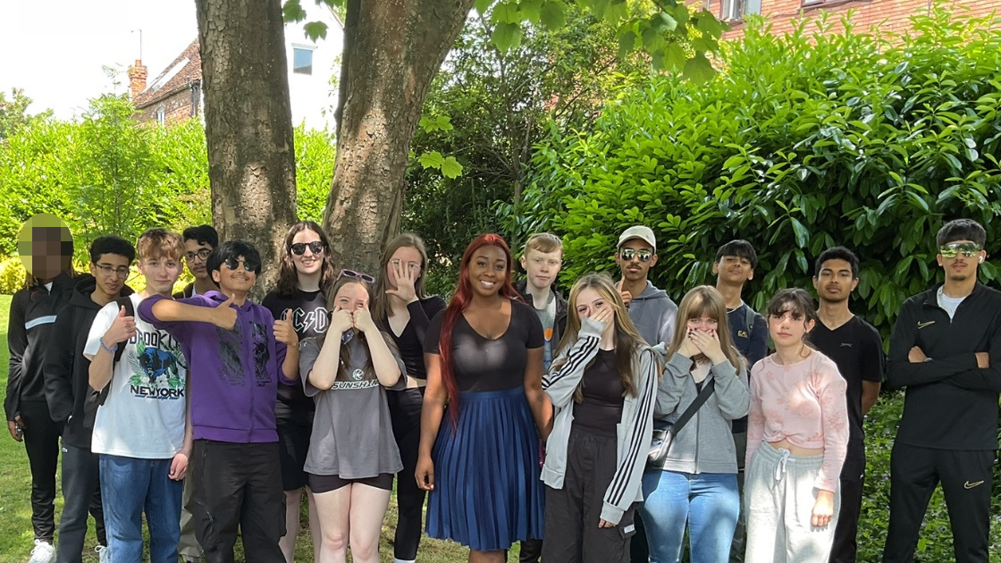 Students posing with teacher
