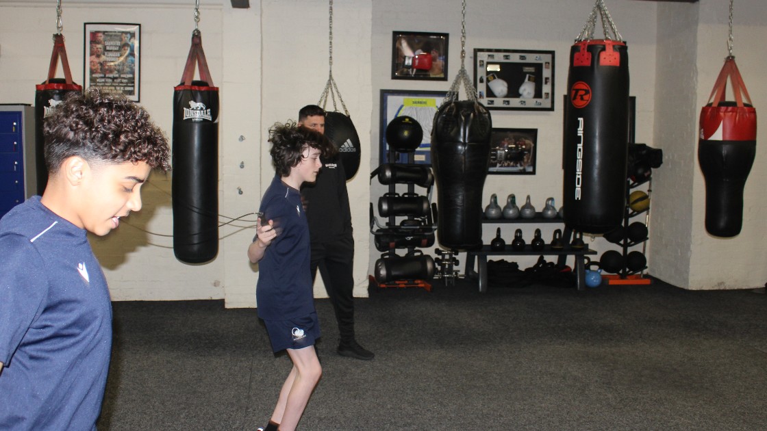 Students warming up by skipping.