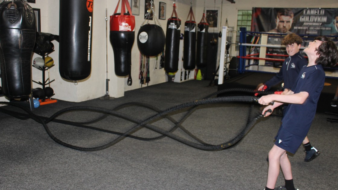Students using the battle ropes.