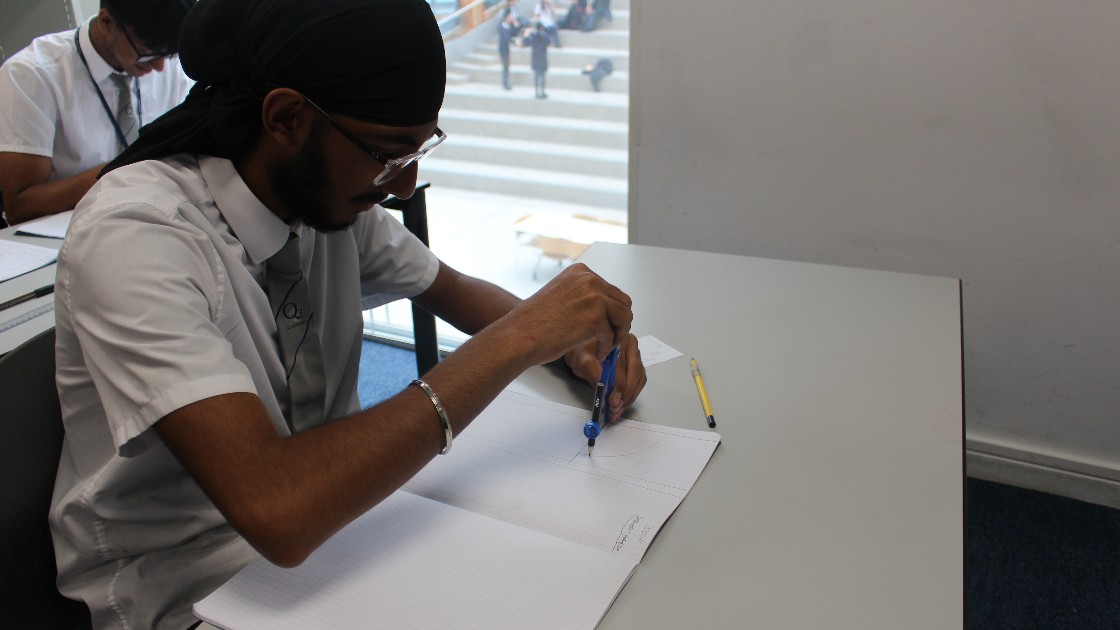 One of our year 10 students using a compass