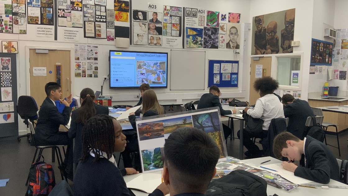 Students in an art classroom working on projects