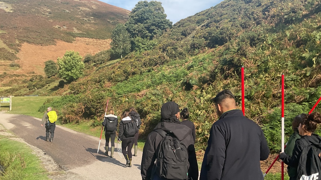 Group of students hiking in Carding Mill Valley