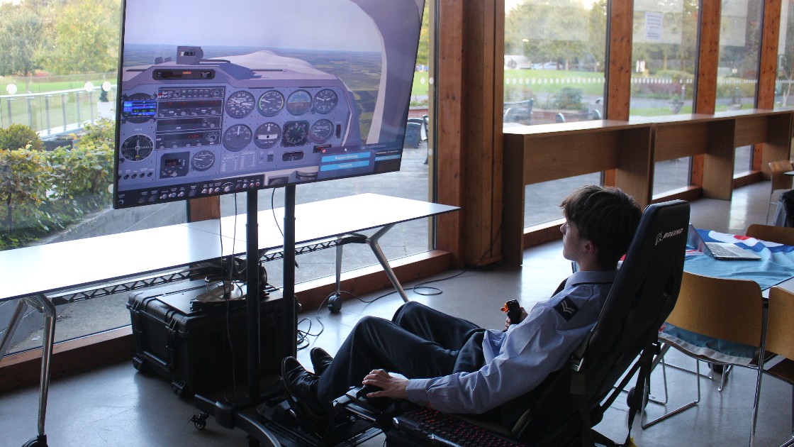 Student using a flight simulator at Open Evening