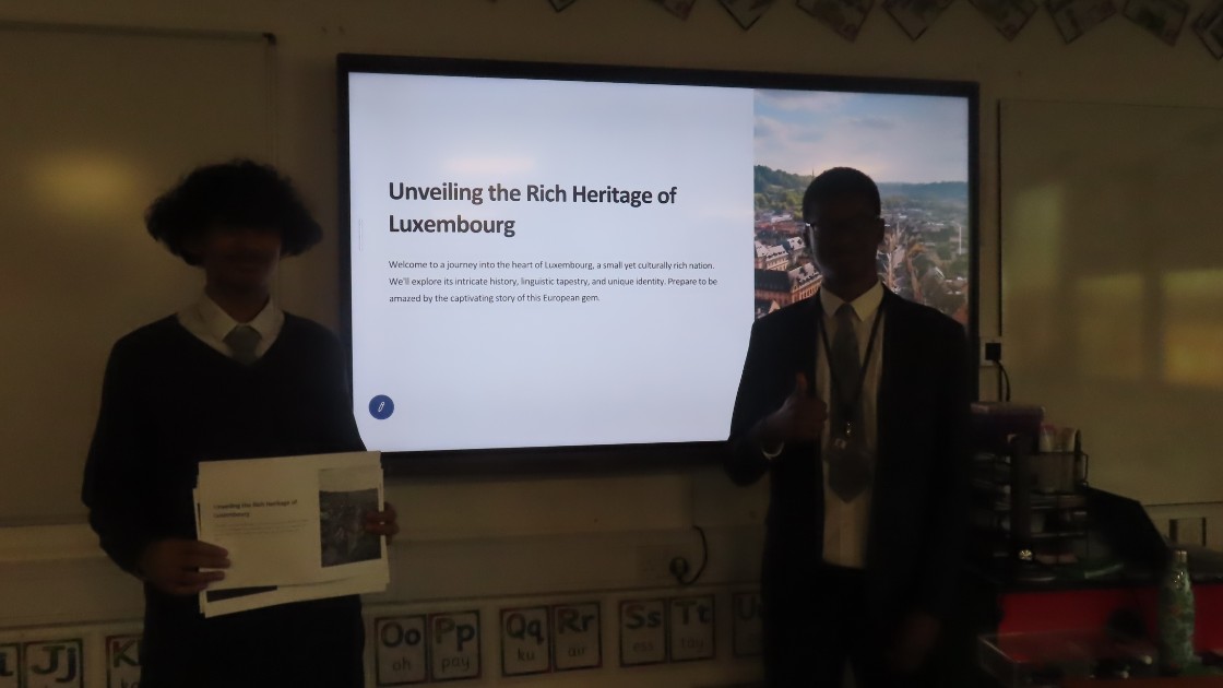 Students presenting their work about the rich heritage of Luxembourg in French
