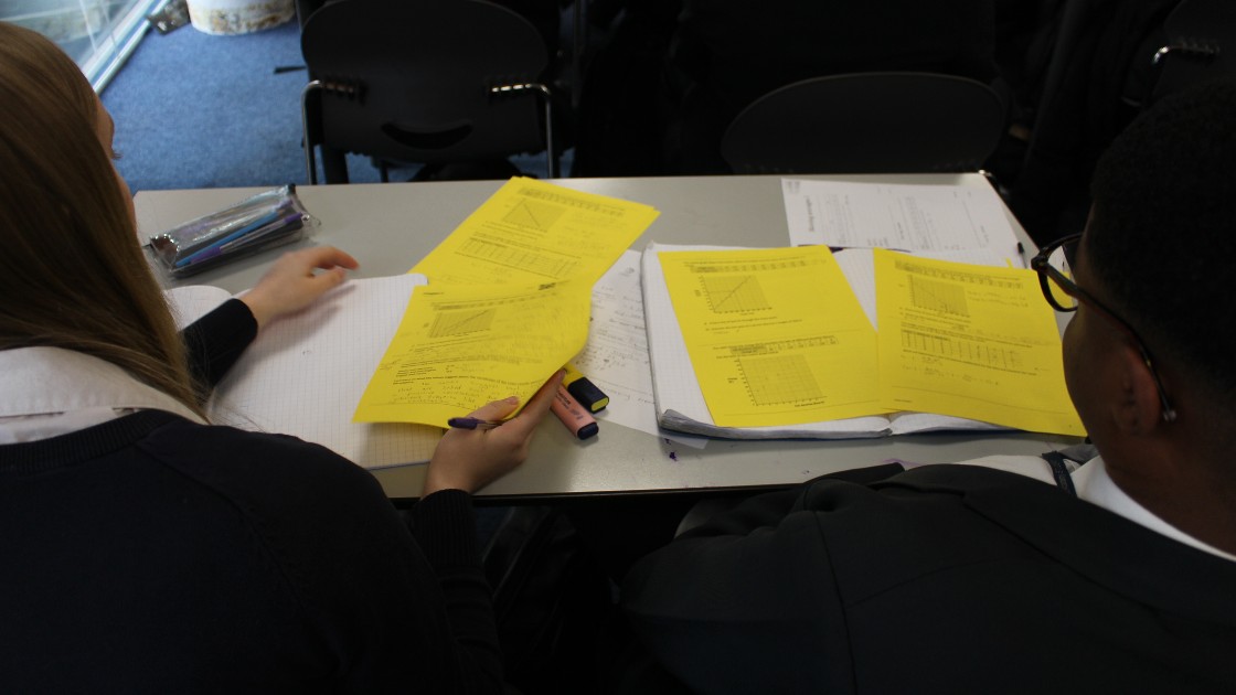 Students working on their assessments during a statistics lesson