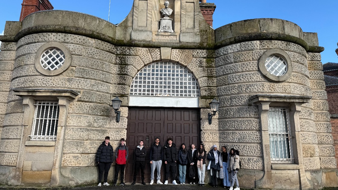 A group of students standing in front of Shrewsbury Prison