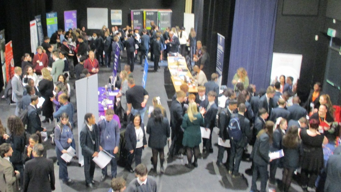 Students and professionals networking at a careers event