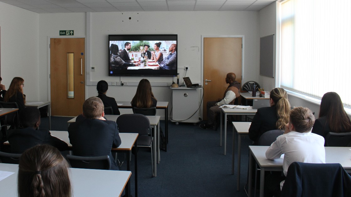 A classroom with Year 9 students watching a video on mental health