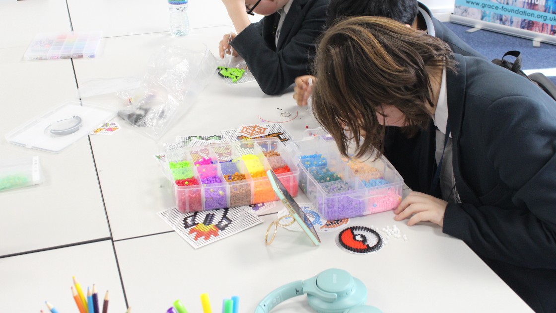 Students creating keepsake items during Craft Club
