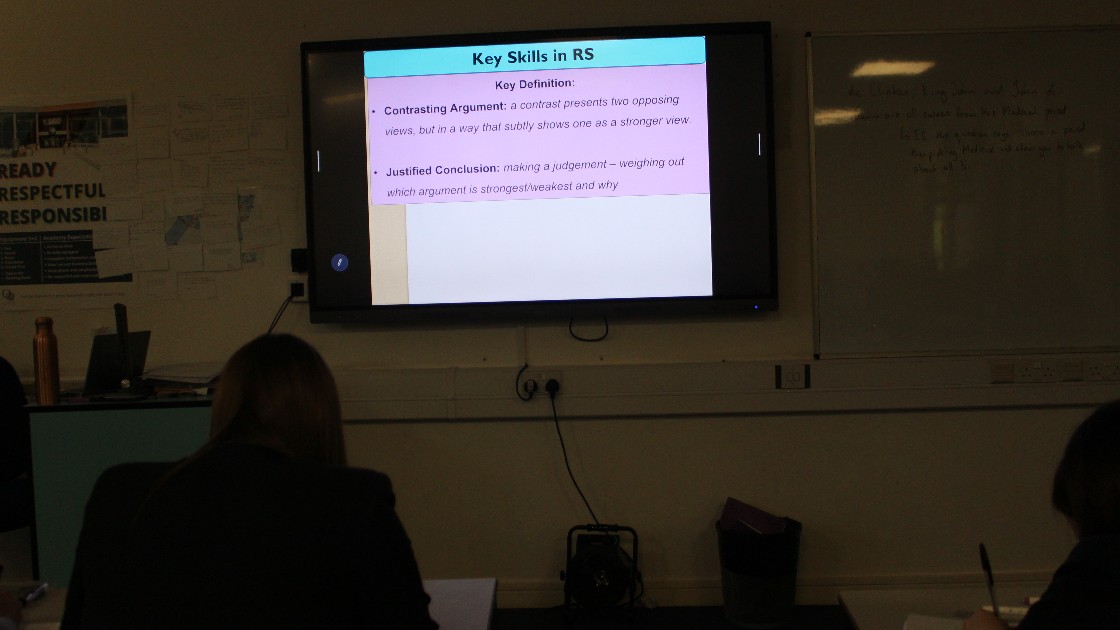 Students in a classroom watching a presentation on key skills in RS (Religious Studies)
