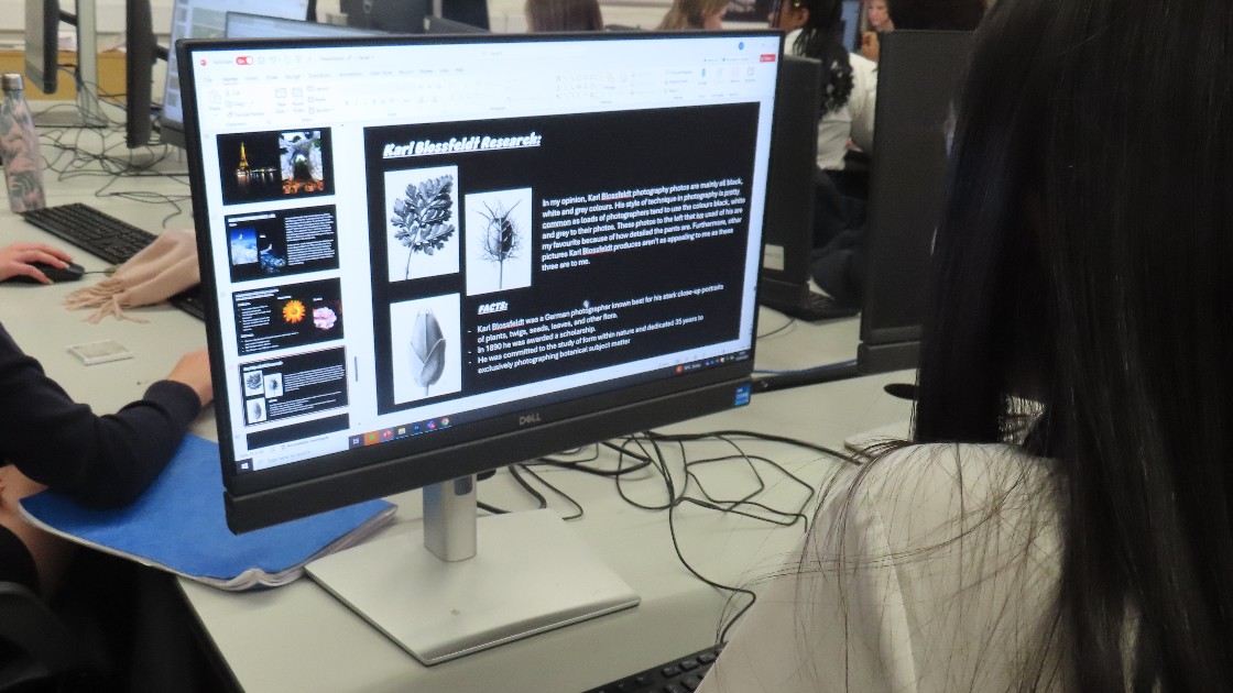 Student working on an art research project on a computer during an Art & Design lesson