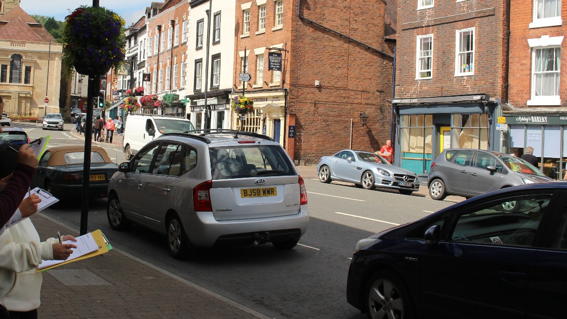 Students with clipboards observing and taking notes on a High street in Bewdley