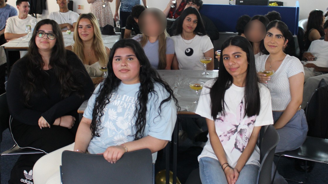 A group of students sitting together at tables during a Summer Leavers' Event