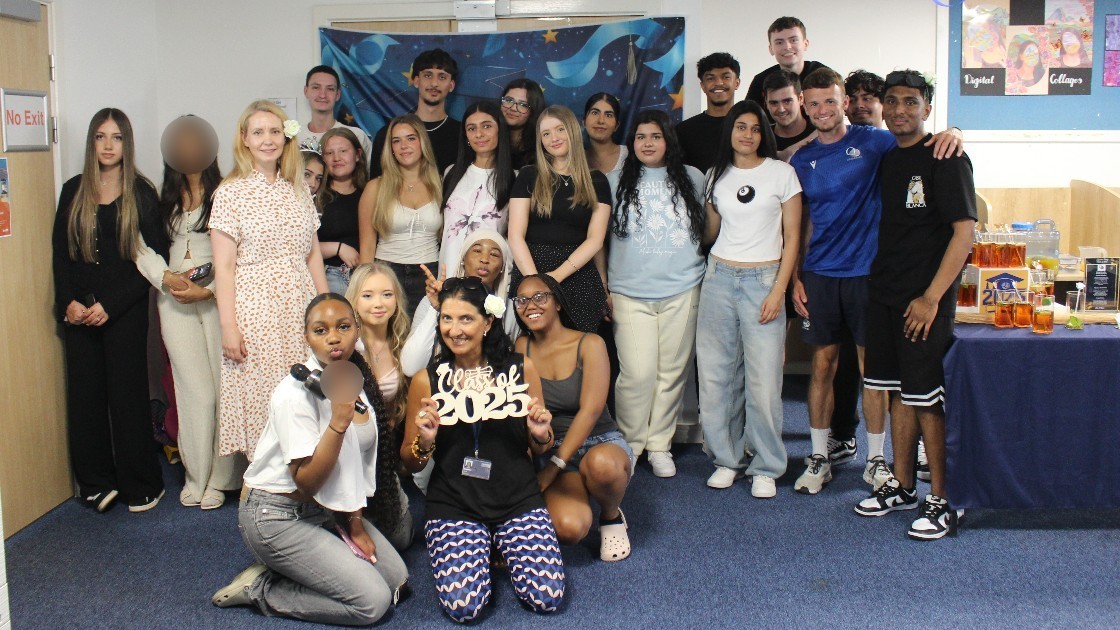 Group of students and teachers posing together at a Summer Leavers' Event.
